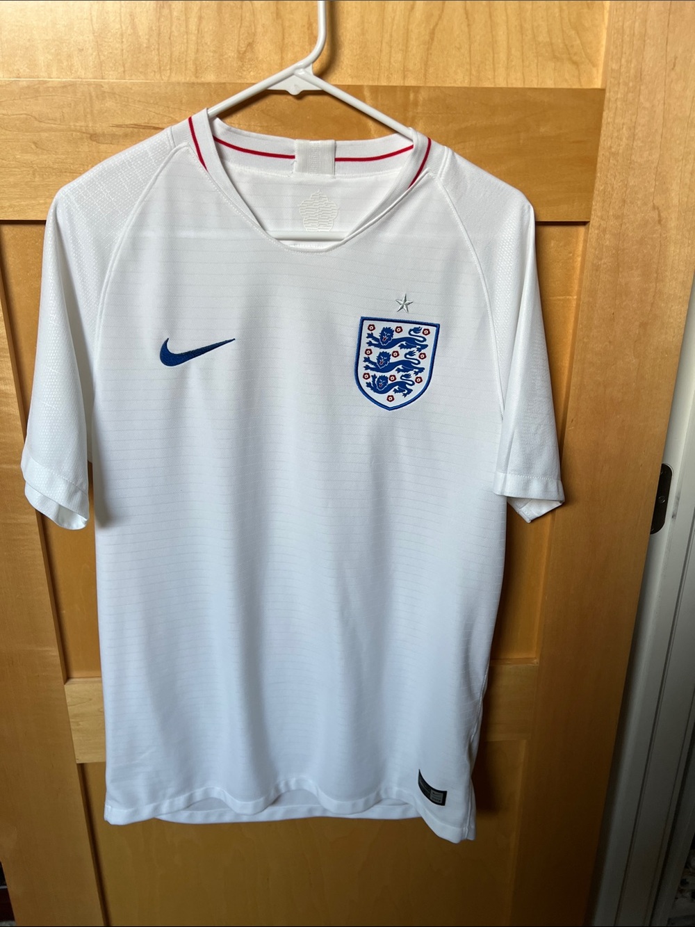 Nike England Men's White Football Jersey with Navy Crest